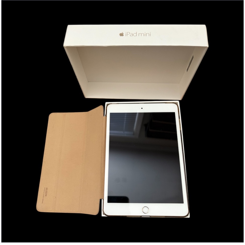Apple iPad Mini with gold protective cover